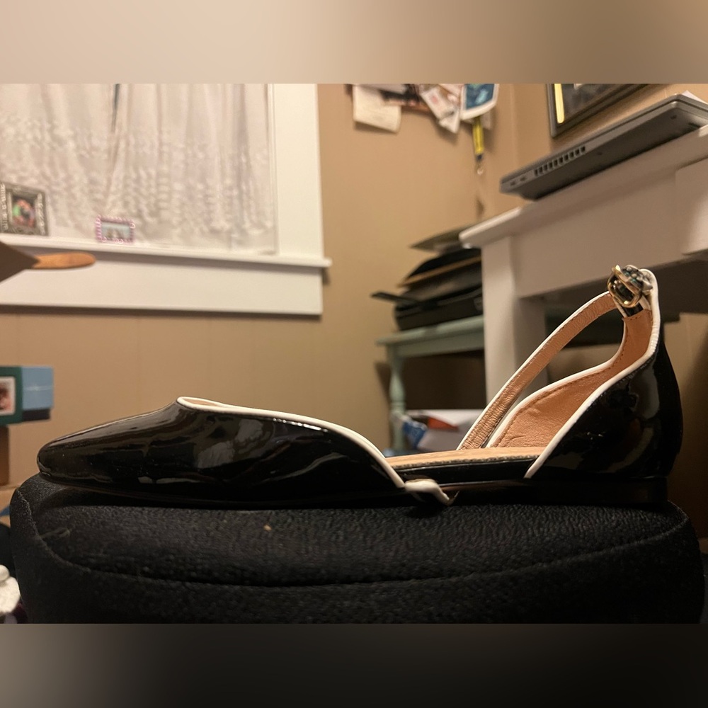 Women’s brand new black Mary Jane’s with white detail.